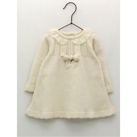 Knitted baby girl dress with flower ornament