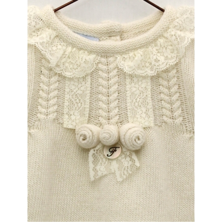 Knitted baby girl dress with flower ornament
