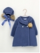 Knitted coat and bonnet with pompoms