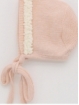 Knitted baby bonnet with wave
