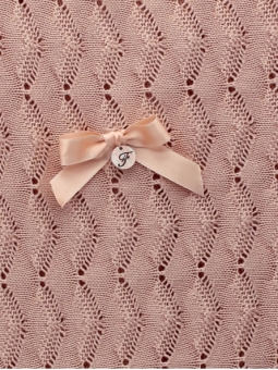 Knitted blanket with bow detail
