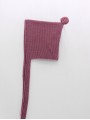 Knitted bonnet with pom pom