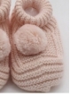 Knitted booties with pompom