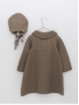 Knitted coat and hood with pompoms