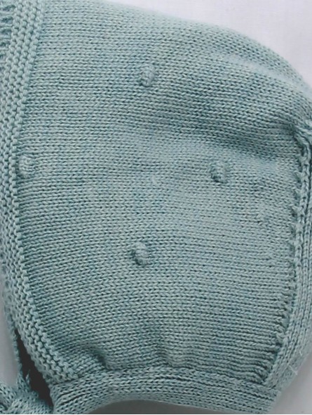 Bonnet with raised embroidery
