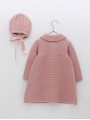 Knitted coat and bonnet with pompoms